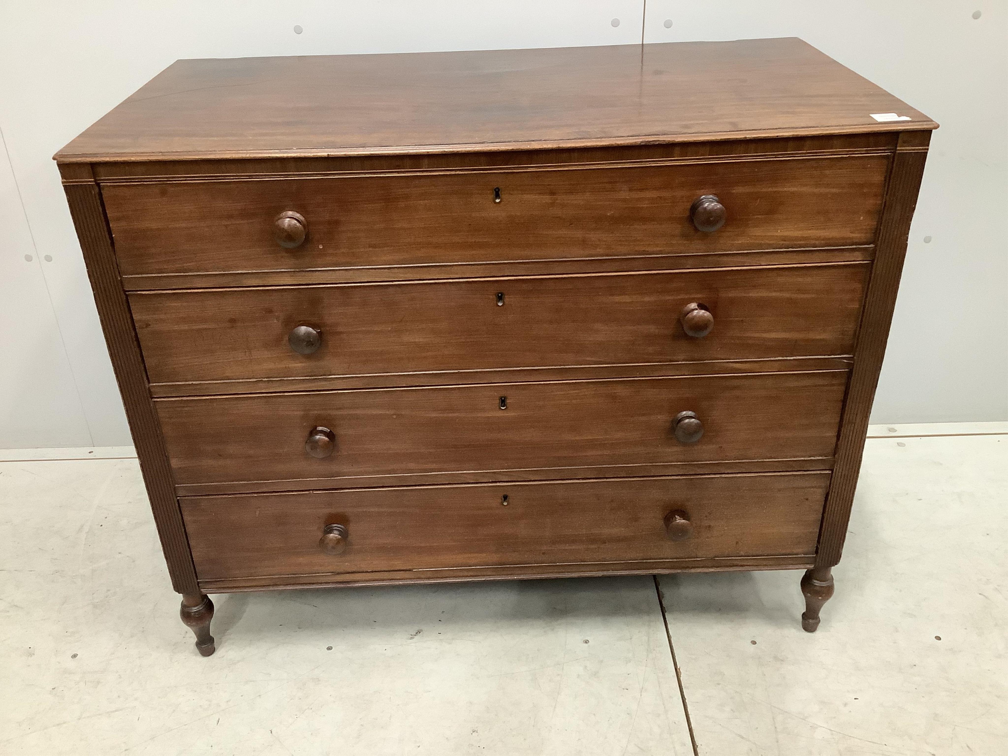 A Regency mahogany straight front chest of four drawers, with reeded pilasters, width 108cm, depth 55cm, height 87cm. Condition - poor to fair, some minor losses